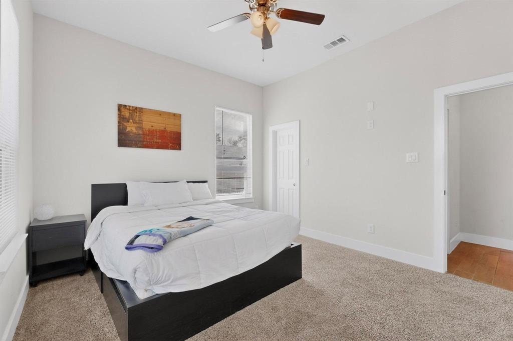 2015 Volga Avenue Dallas, TX 75216 - Photo 28 of 38 Bedroom with carpet floors and a ceiling fan