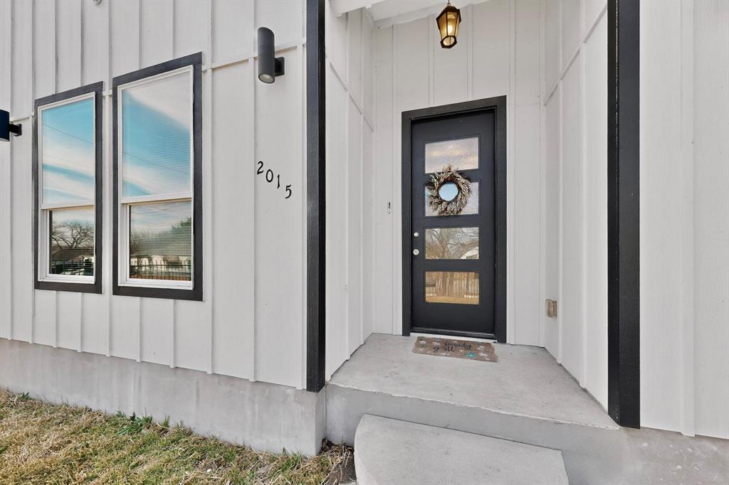 2015 Volga Avenue Dallas, TX 75216 - Photo 3 of 38 Property entrance with board and batten siding