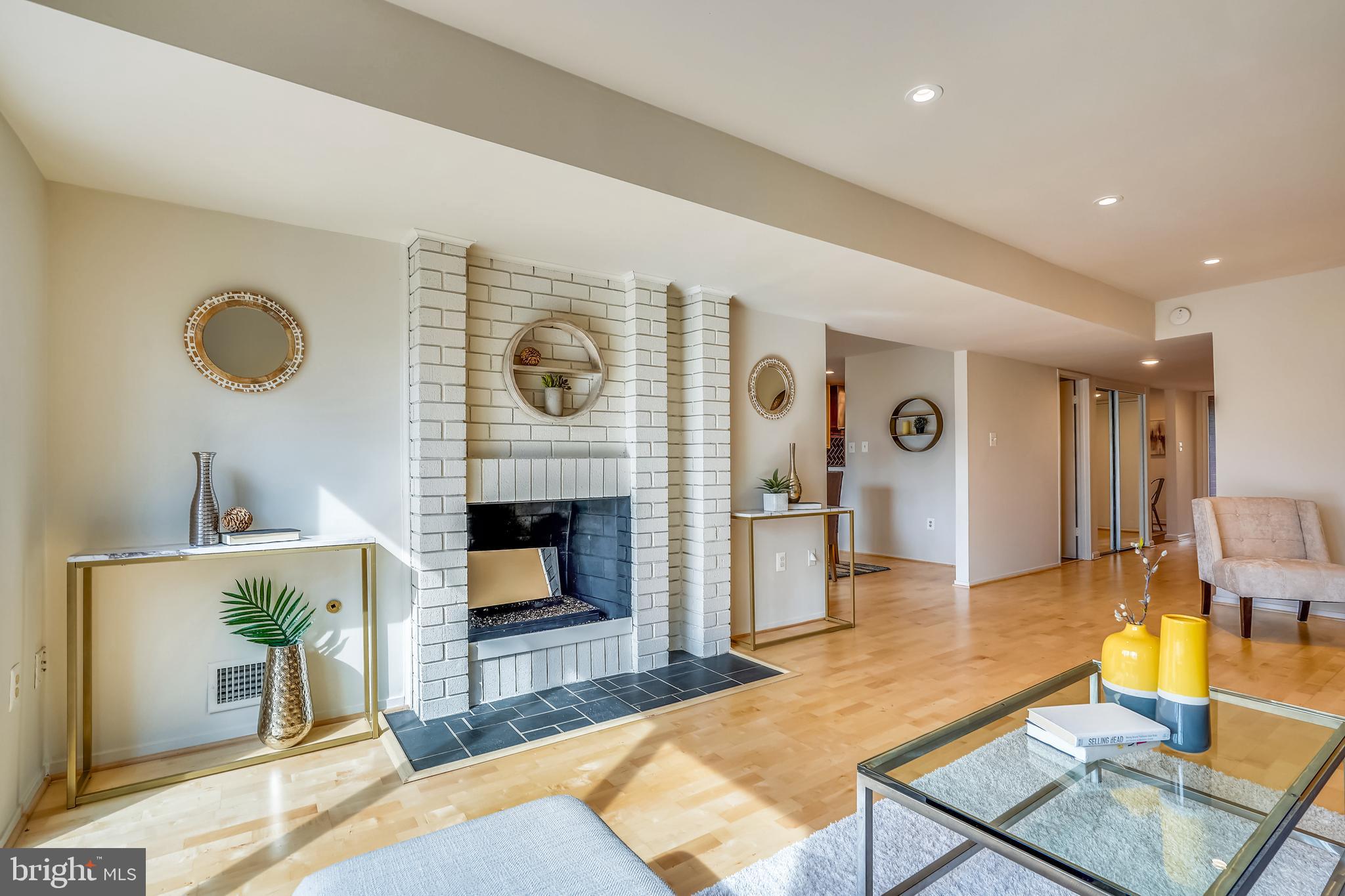 11797 Indian Ridge Road Reston, VA 20191 - Photo 2 of 33 a living room with furniture and a fireplace