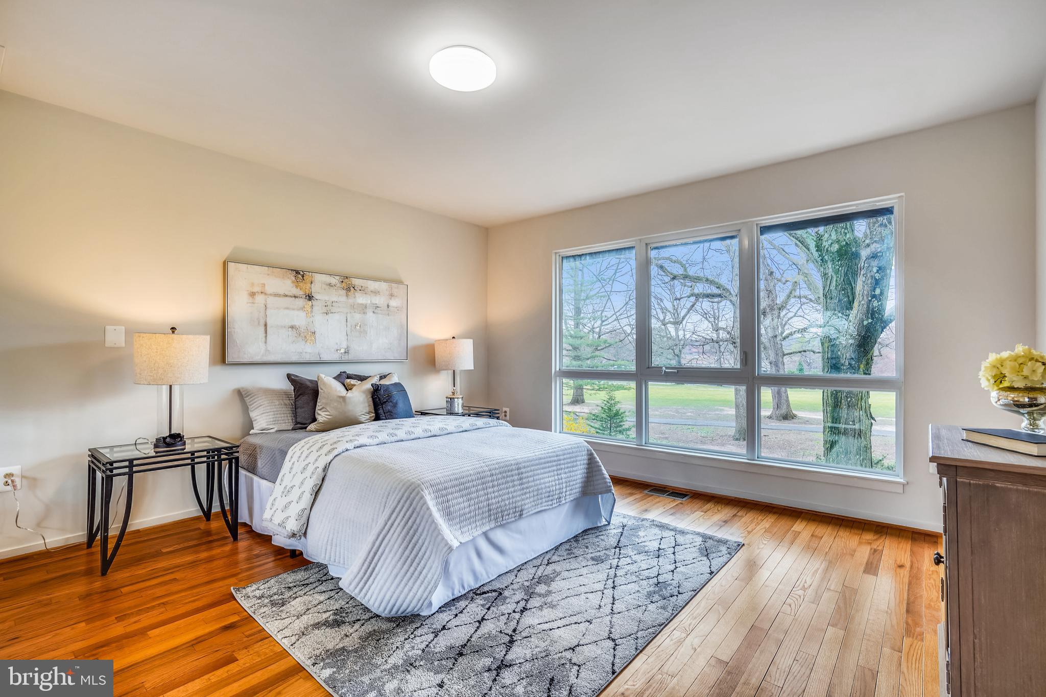11797 Indian Ridge Road Reston, VA 20191 - Photo 16 of 33 a bedroom with a bed and a large window