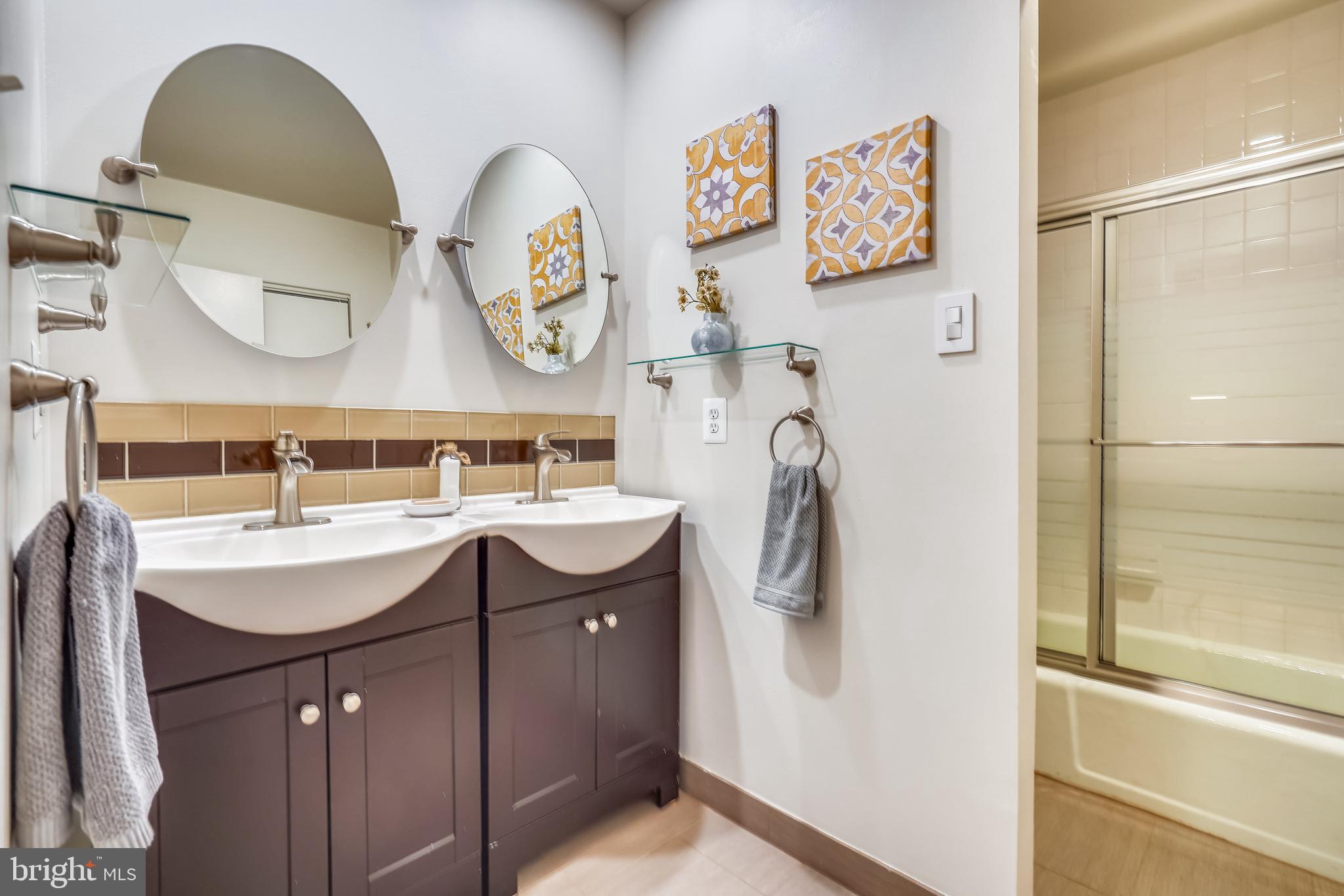 11797 Indian Ridge Road Reston, VA 20191 - Photo 24 of 33 a bathroom with a sink and a mirror