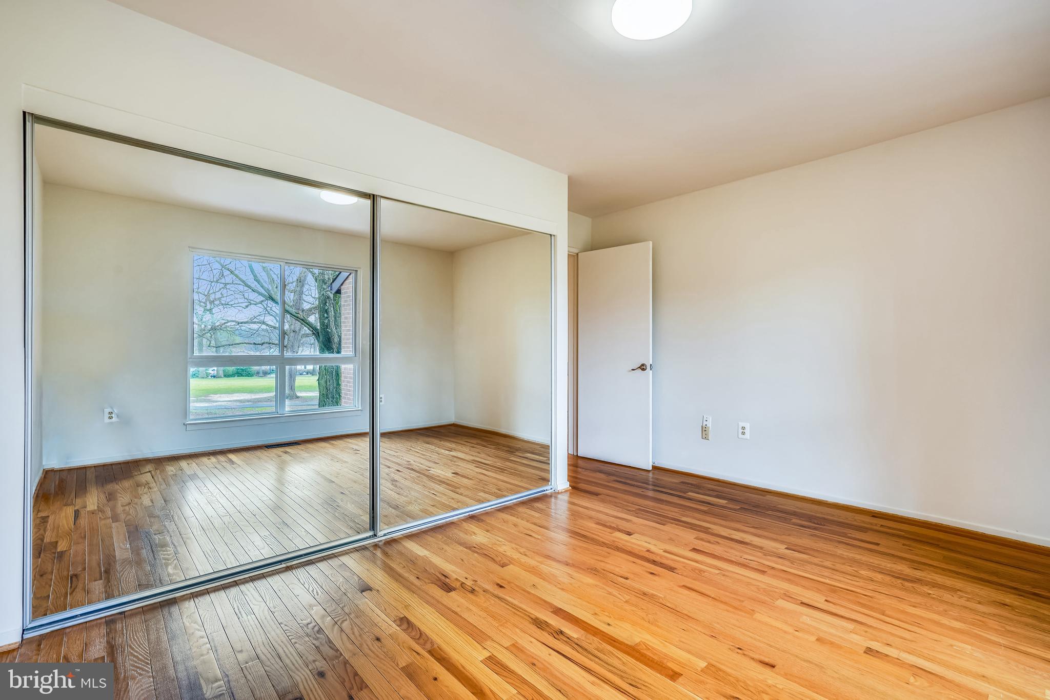 11797 Indian Ridge Road Reston, VA 20191 - Photo 26 of 33 a view of empty room with wooden floor and fan