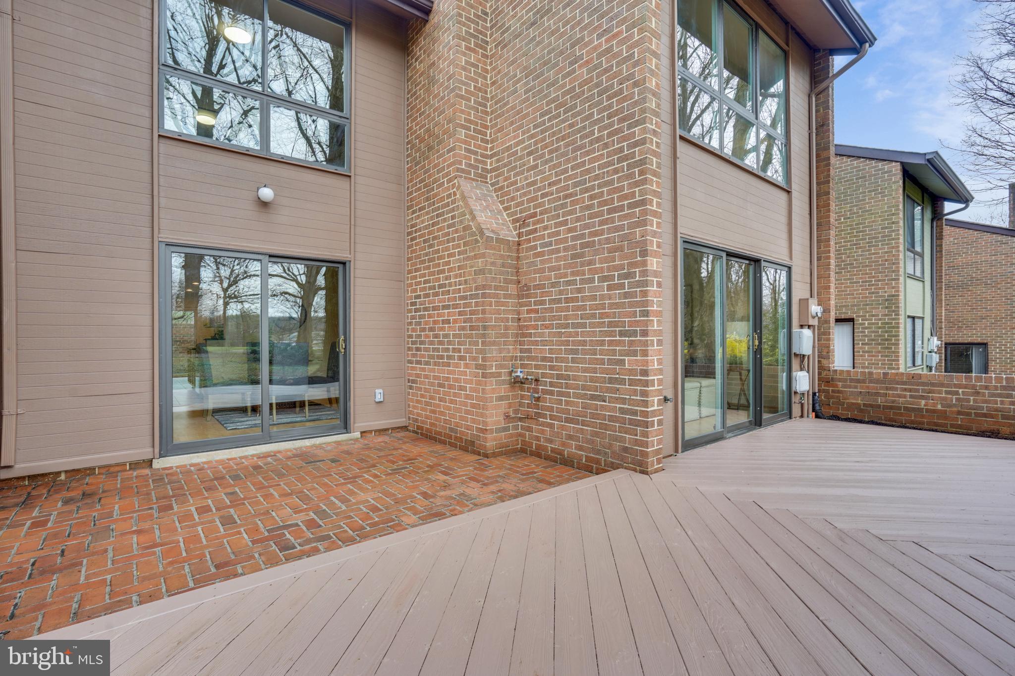 11797 Indian Ridge Road Reston, VA 20191 - Photo 27 of 33 a view of a brick house with a large window
