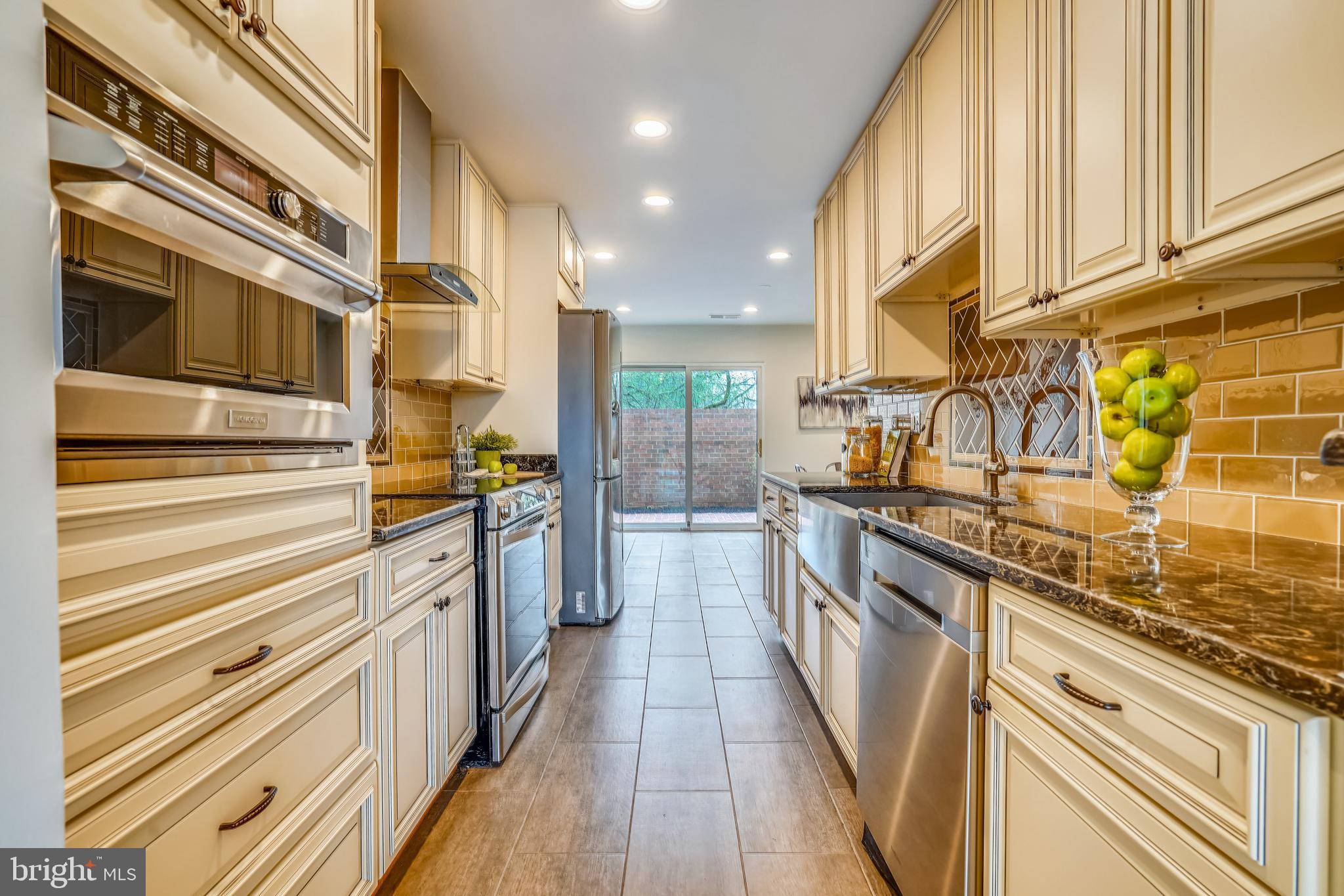 11797 Indian Ridge Road Reston, VA 20191 - Photo 7 of 33 a kitchen with stainless steel appliances a sink and cabinets