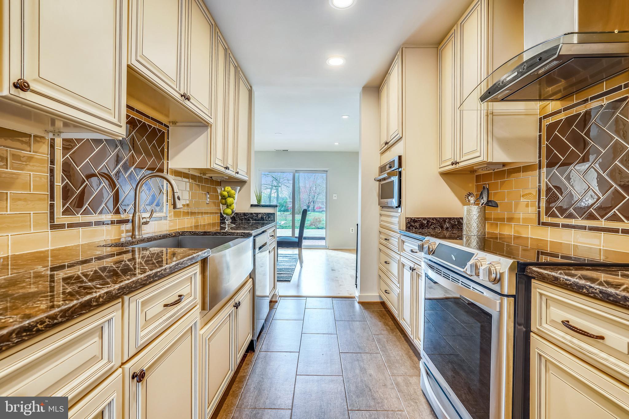 11797 Indian Ridge Road Reston, VA 20191 - Photo 8 of 33 a kitchen with stainless steel appliances granite countertop a stove and a sink
