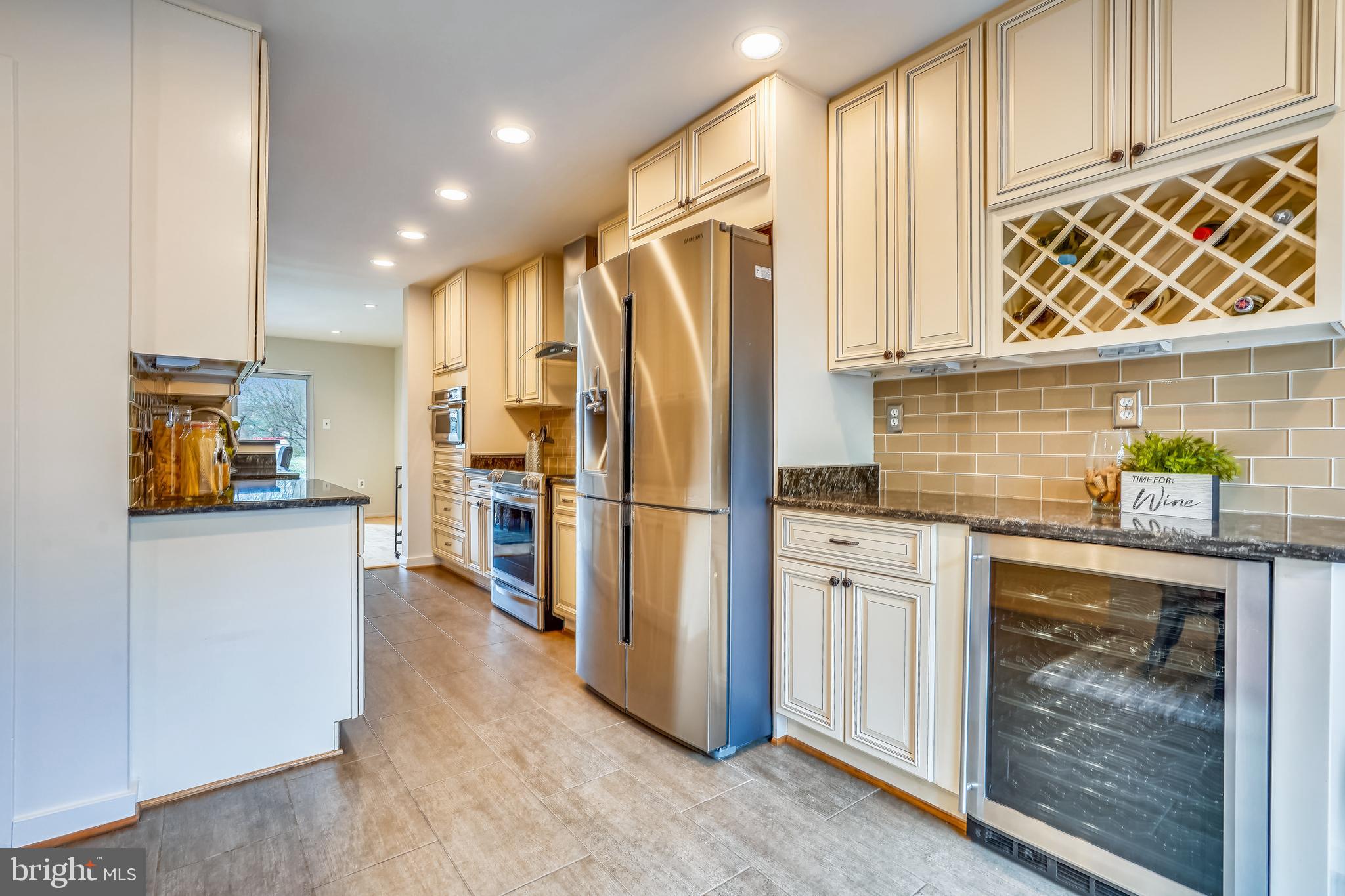 11797 Indian Ridge Road Reston, VA 20191 - Photo 10 of 33 a kitchen with stainless steel appliances a refrigerator and a sink