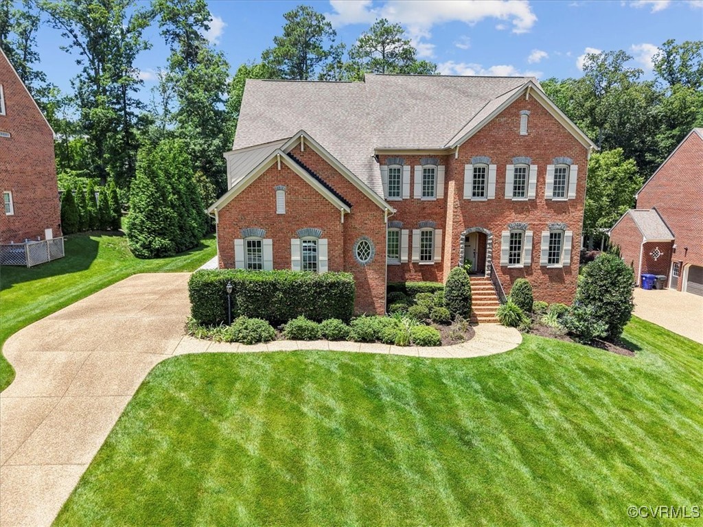 3206 Fulbrook Drive Midlothian, VA 23113 - Photo 1 of 18 a front view of a house with a yard