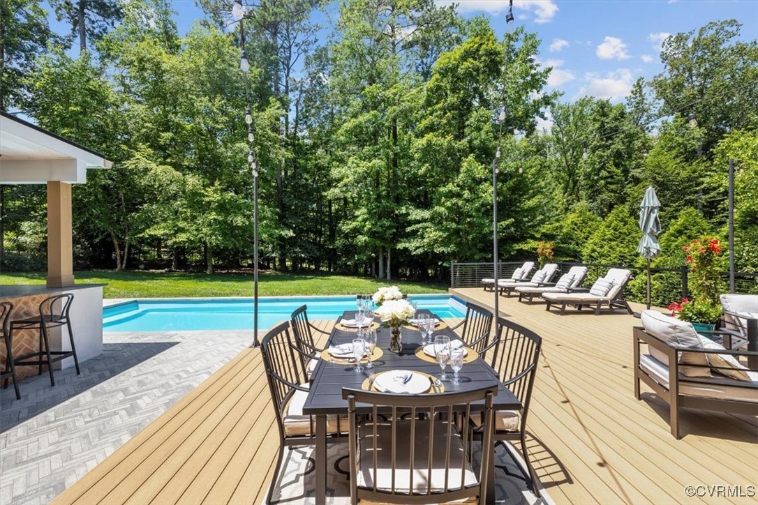 3206 Fulbrook Drive Midlothian, VA 23113 - Photo 8 of 18 a view of a patio with a dining table and chairs with wooden floor and fence