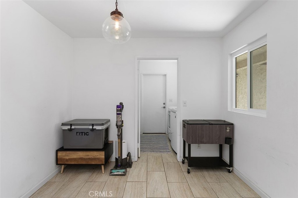 5082 Los Olivos Way Riverside, CA 92505 - Photo 12 of 36 a view of a workspace with furniture and wooden floor