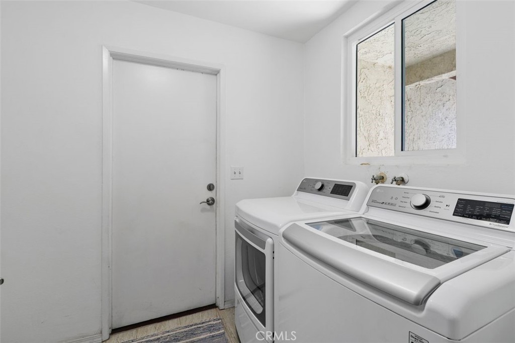 5082 Los Olivos Way Riverside, CA 92505 - Photo 13 of 36 a utility room with dryer and washer