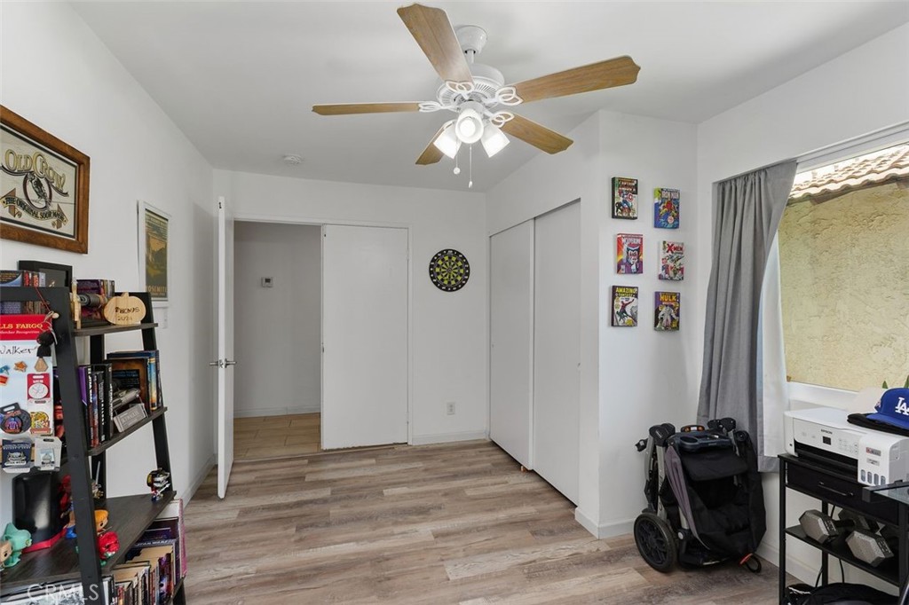 5082 Los Olivos Way Riverside, CA 92505 - Photo 19 of 36 a view of a workspace with furniture and closet
