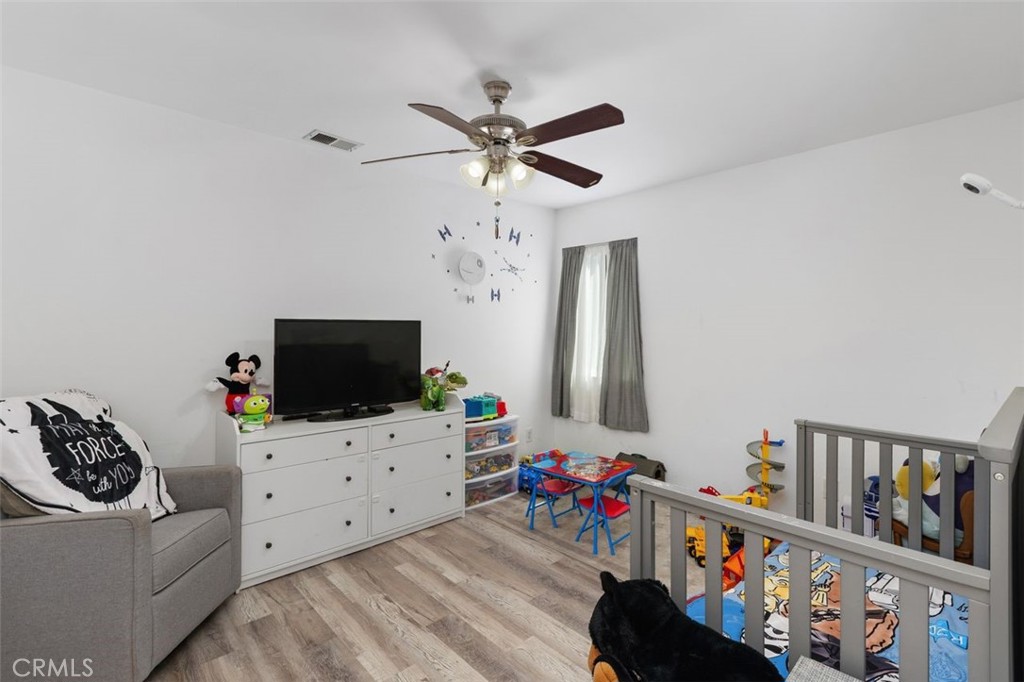 5082 Los Olivos Way Riverside, CA 92505 - Photo 20 of 36 a living room with furniture and a flat screen tv
