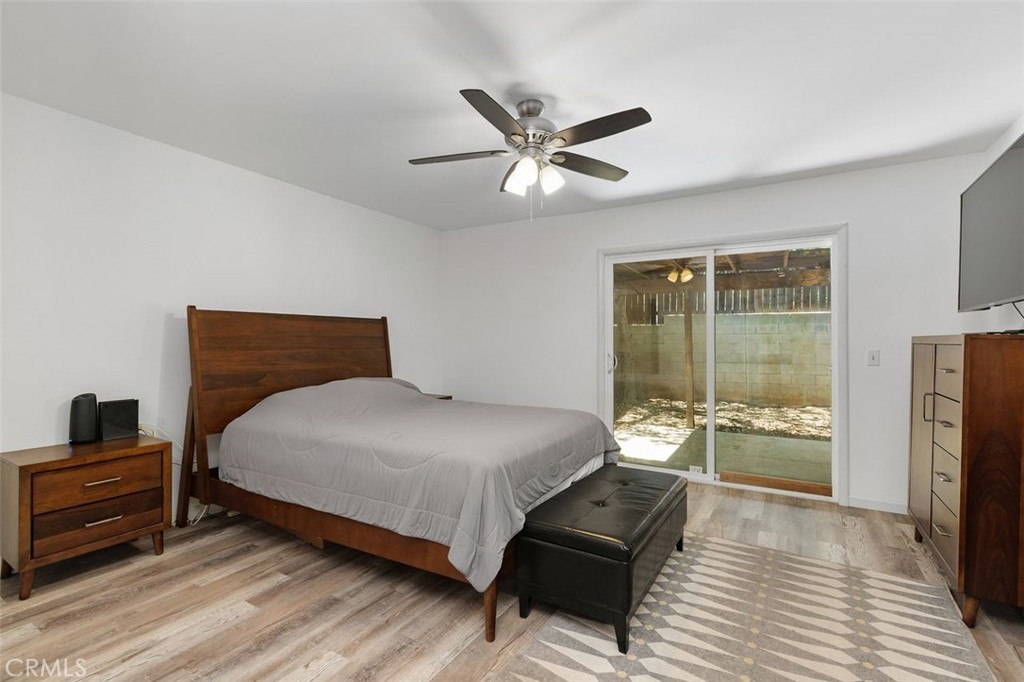 5082 Los Olivos Way Riverside, CA 92505 - Photo 24 of 36 a bedroom with a bed and a large window