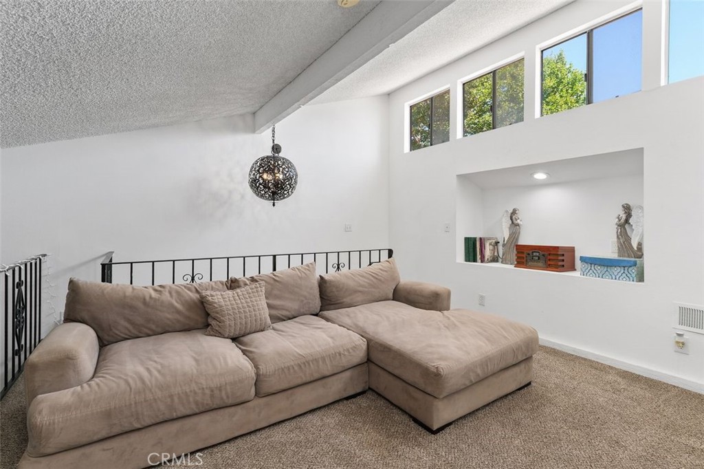 5082 Los Olivos Way Riverside, CA 92505 - Photo 29 of 36 a living room with furniture and a window