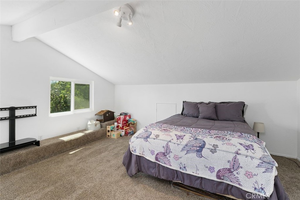 5082 Los Olivos Way Riverside, CA 92505 - Photo 30 of 36 a bedroom with a bed and windows