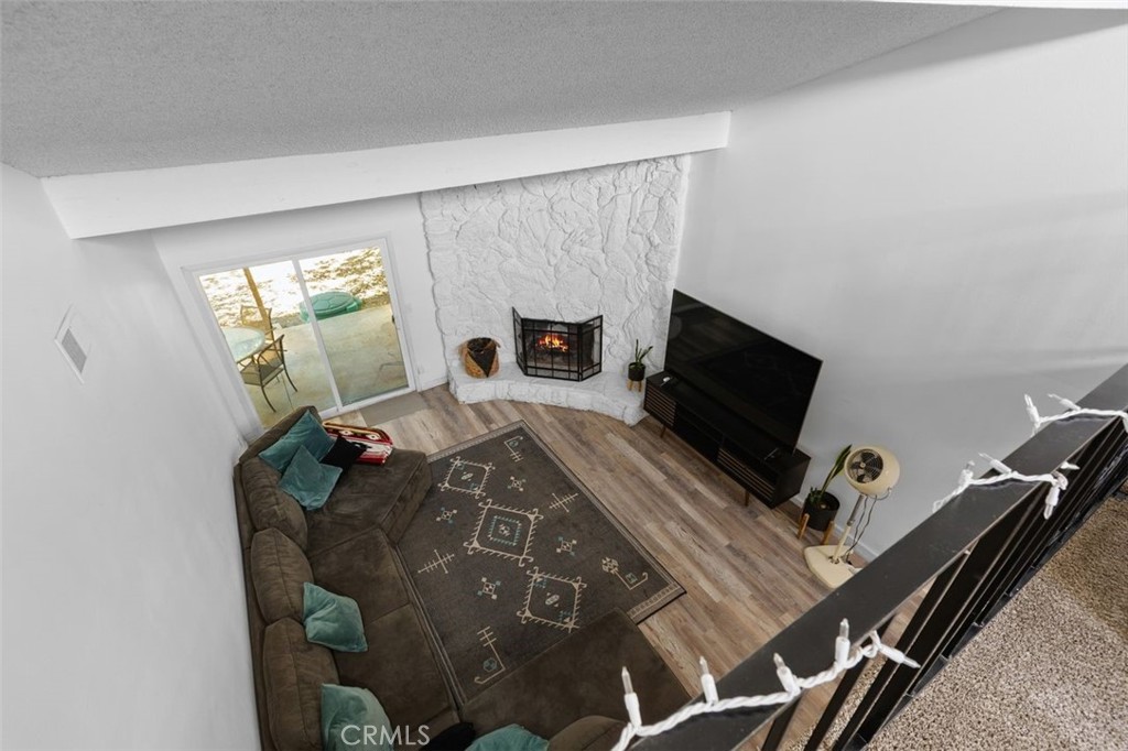 5082 Los Olivos Way Riverside, CA 92505 - Photo 32 of 36 a living room with furniture and a flat screen tv