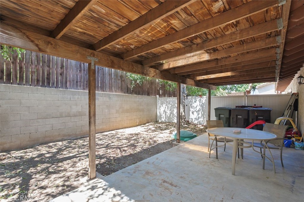 5082 Los Olivos Way Riverside, CA 92505 - Photo 34 of 36 a outdoor space with lots of furniture and racks