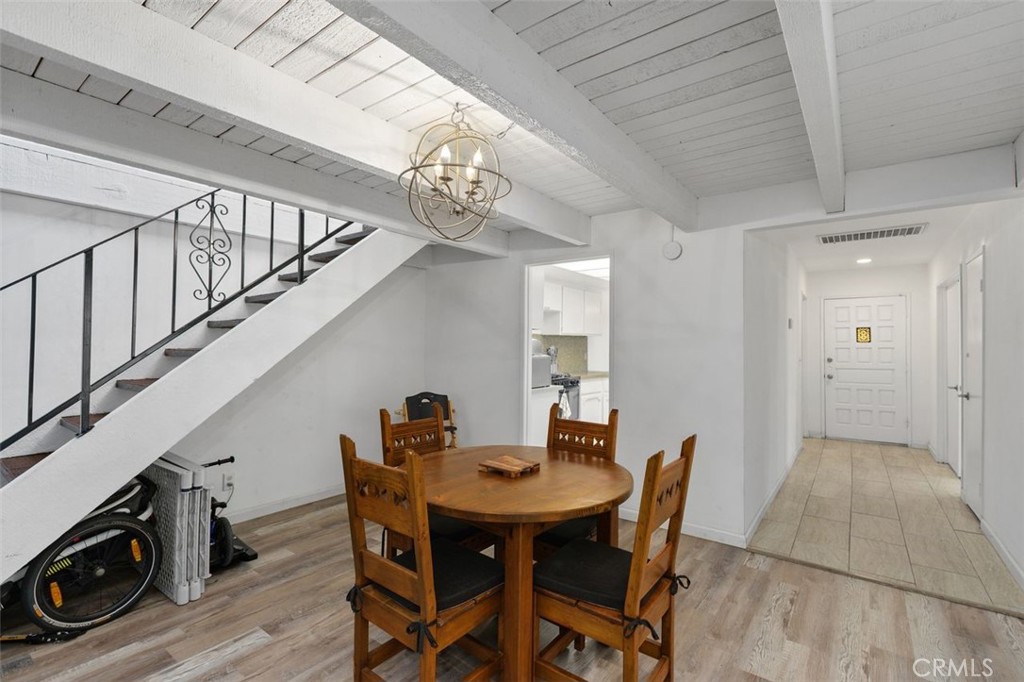 5082 Los Olivos Way Riverside, CA 92505 - Photo 10 of 36 a view of a dining room with furniture and wooden floor