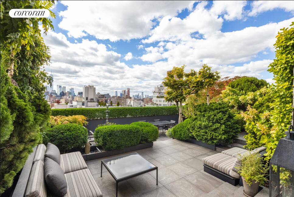 a view of a garden with sitting area