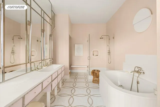 a bathroom with a tub sink and mirror