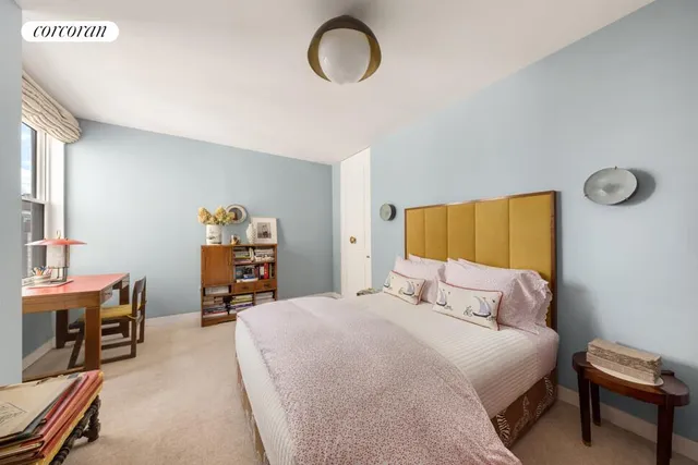 a bedroom with a bed and a cabinets