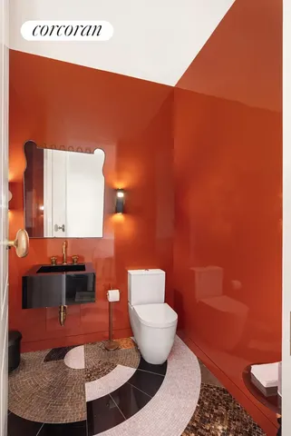 a bathroom with a toilet and a sink