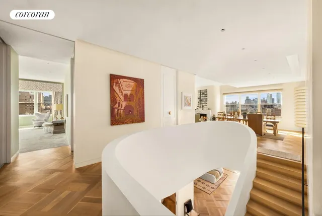 a living room with a large window and table