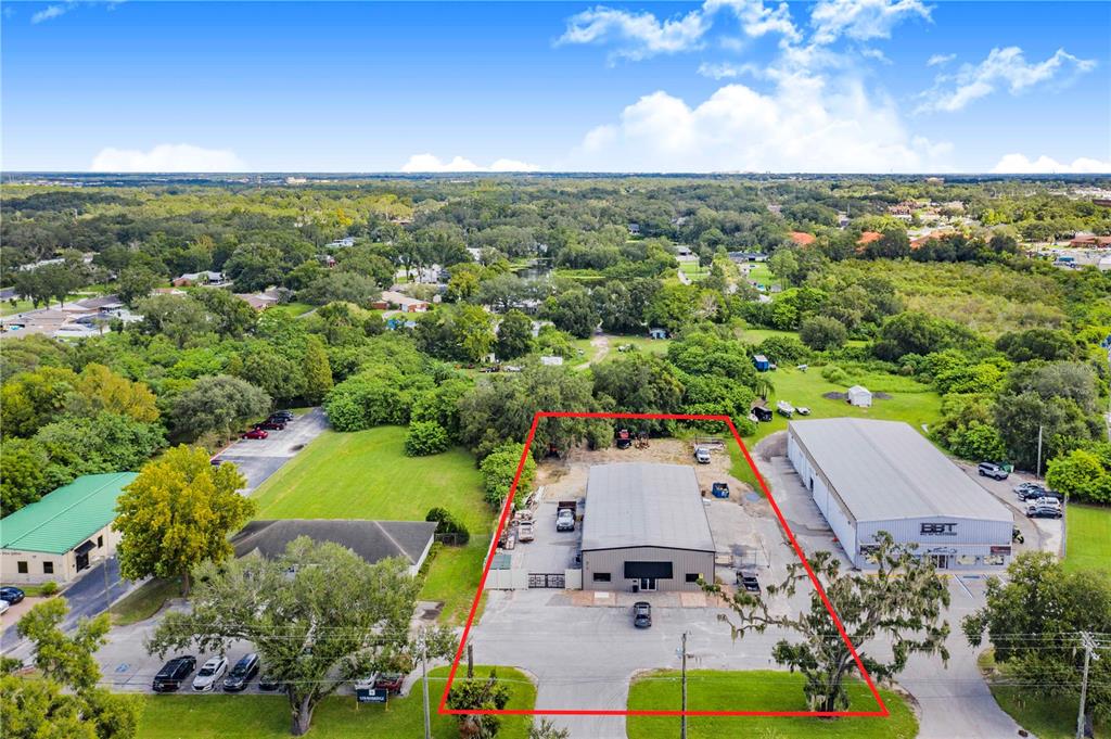 an aerial view of a house with a garden