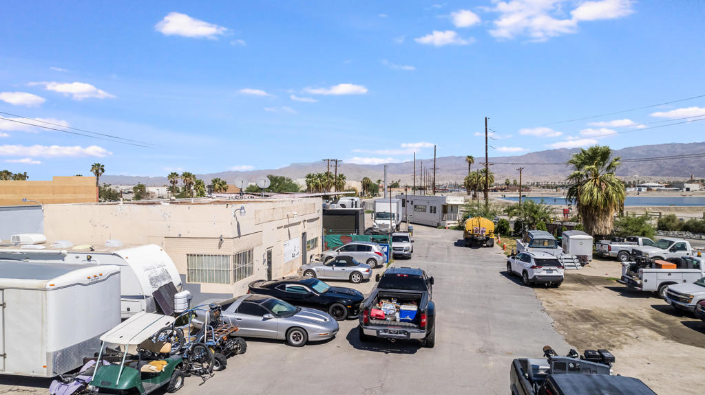 84035 Cabazon Road Indio, CA 92201 - Photo 4 of 21 a view of a parking space with lots of cars and parked cars