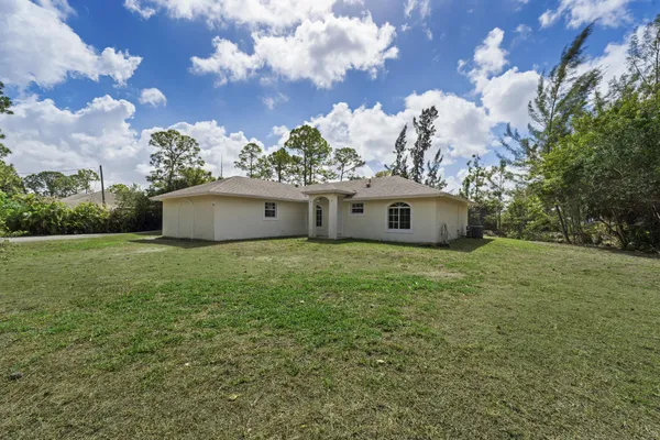 a aerial view of a house with a yard