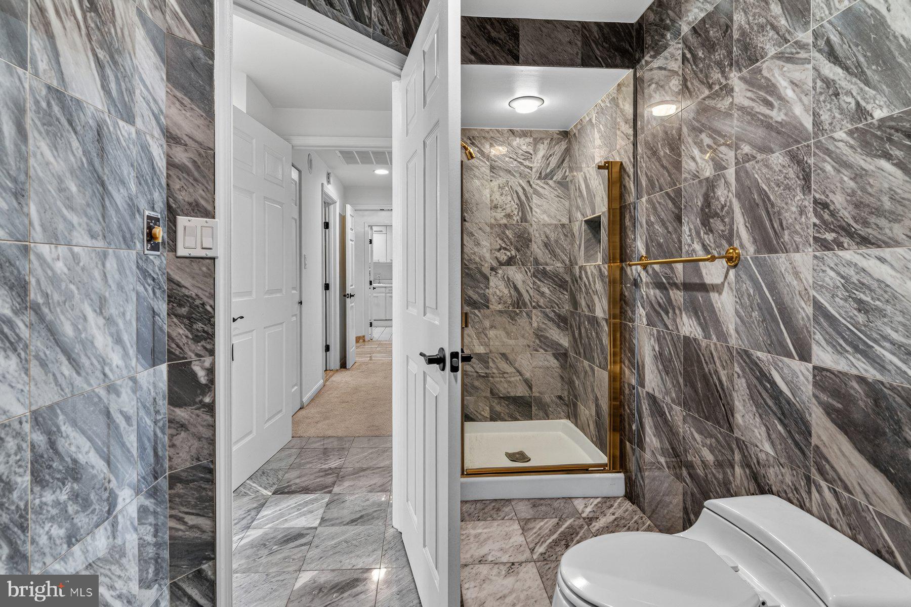 3801 Canterbury Road, Unit 403 Baltimore, MD 21218 - Photo 20 of 25 Elegant marble bathroom retreat.