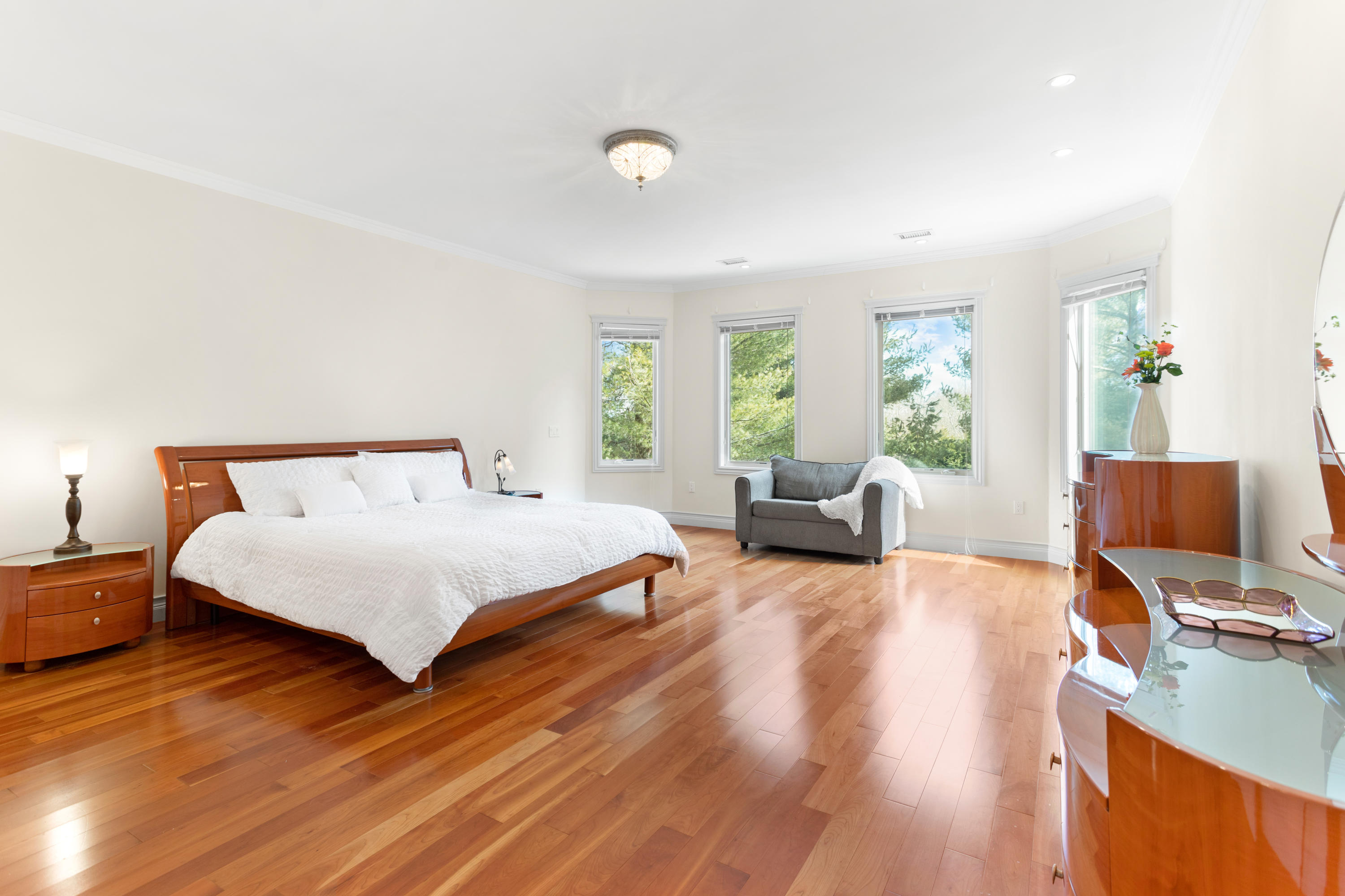 10 Starboard Lane Osterville, MA 02655 - Photo 12 of 22 a spacious bedroom with a bed and wooden floor