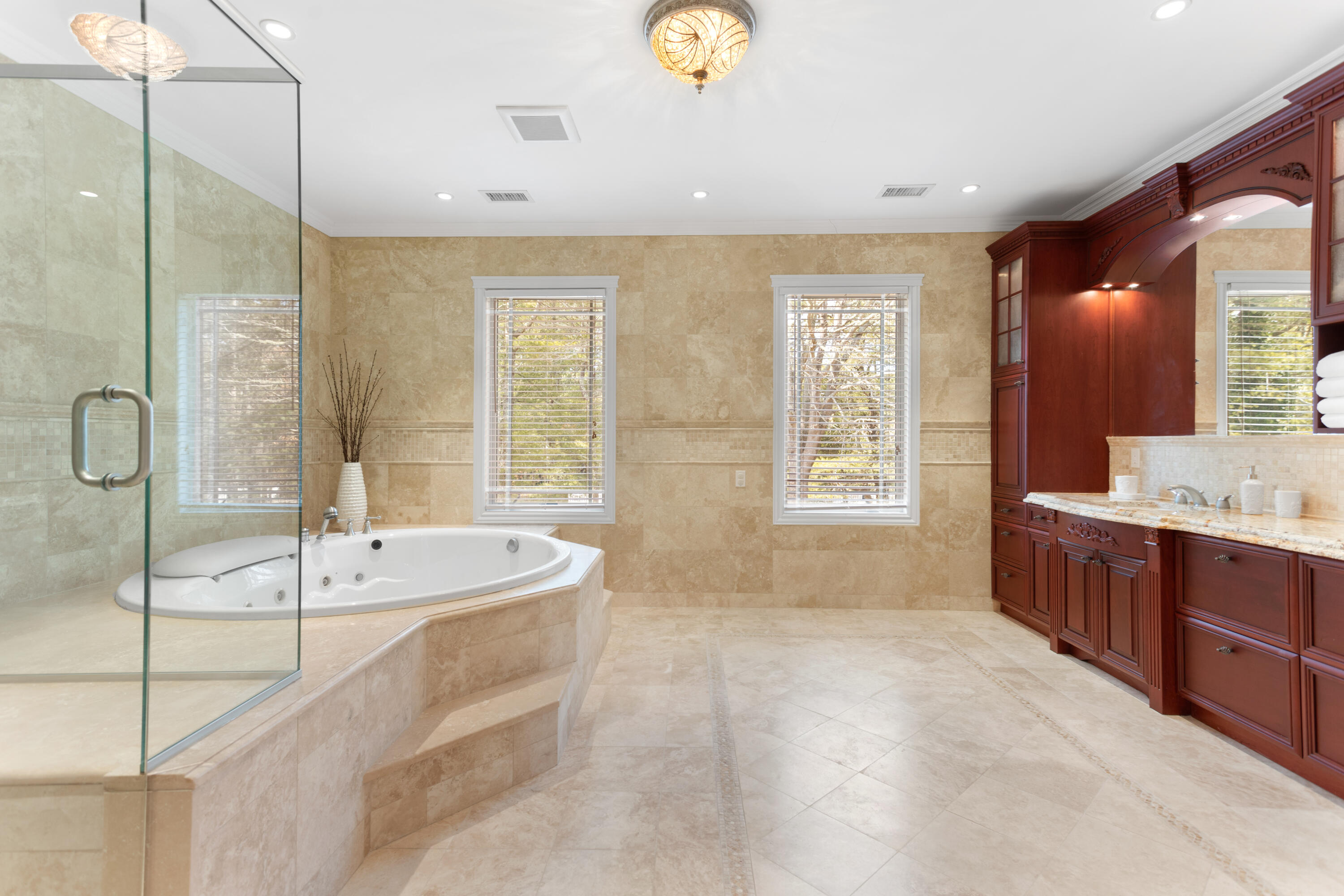 10 Starboard Lane Osterville, MA 02655 - Photo 14 of 22 a spacious bathroom with a tub sink and mirror