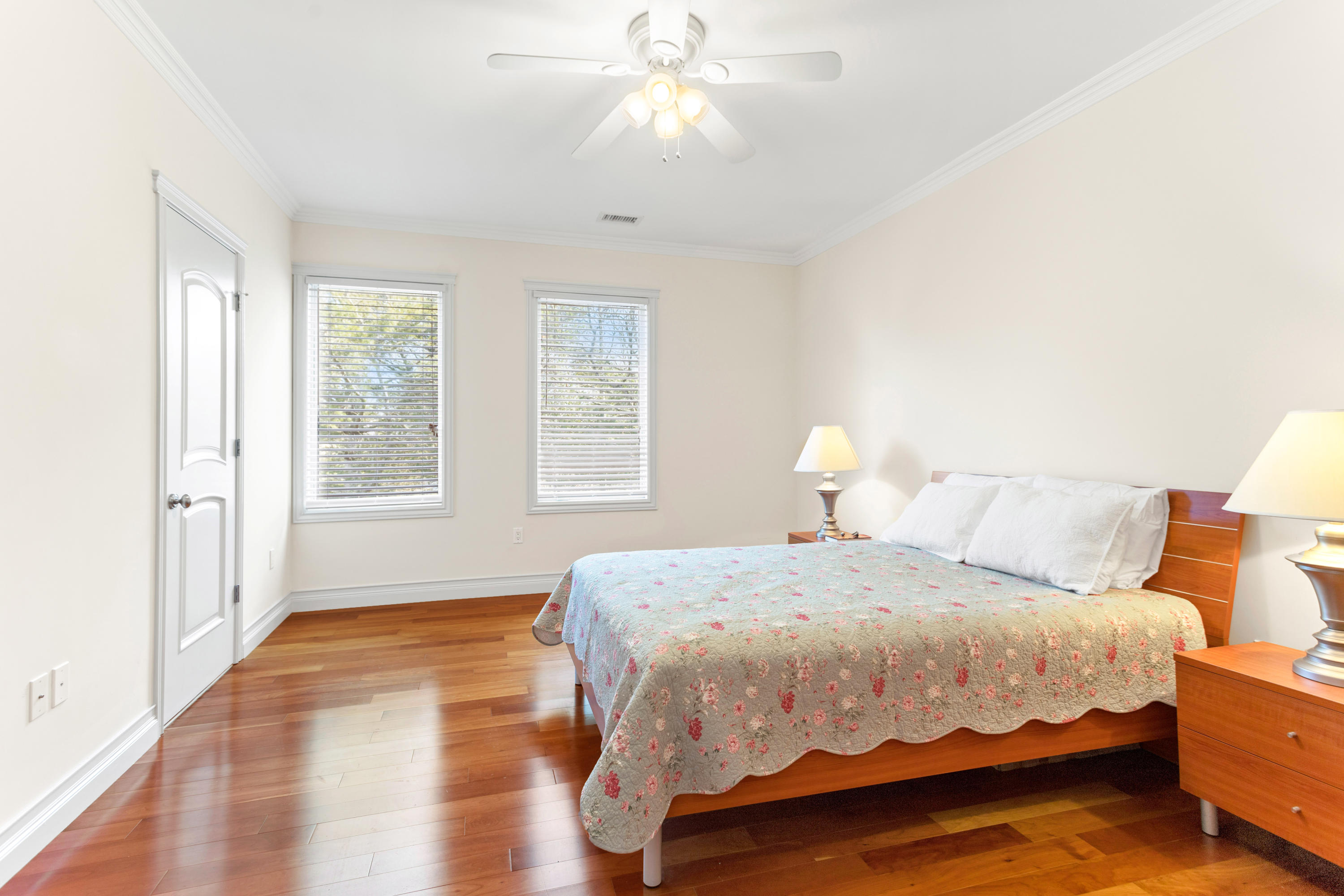 10 Starboard Lane Osterville, MA 02655 - Photo 16 of 22 a bedroom with a bed and a chandelier