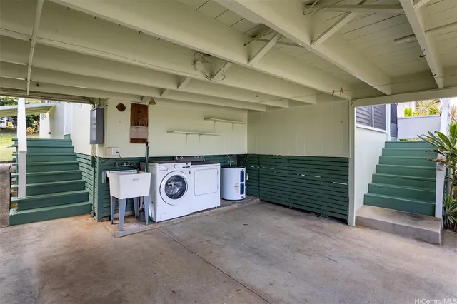 a view of a room with stairs and a large window