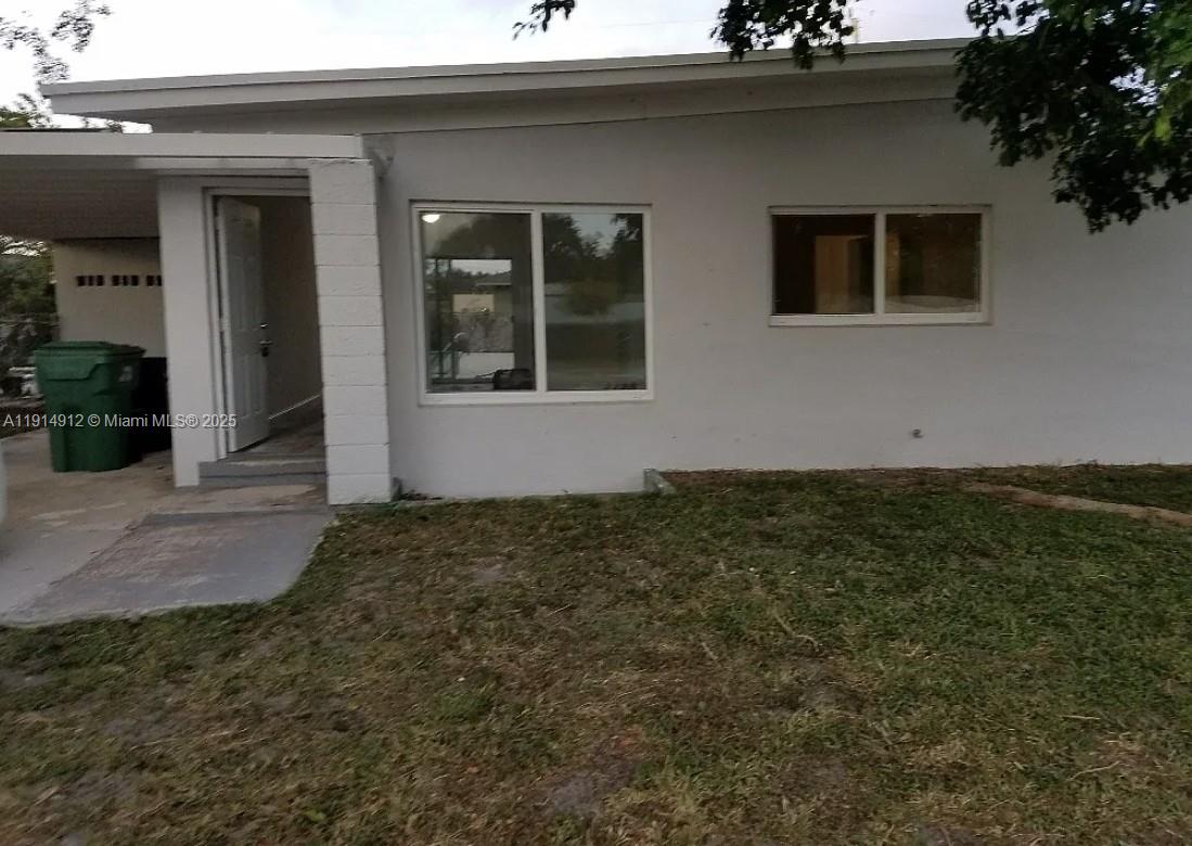 2125 Northwest 126th Street Miami, FL 33167 - Photo 6 of 6 a view of a house with a backyard