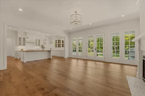a kitchen with kitchen island a counter top space a sink stainless steel appliances and cabinets