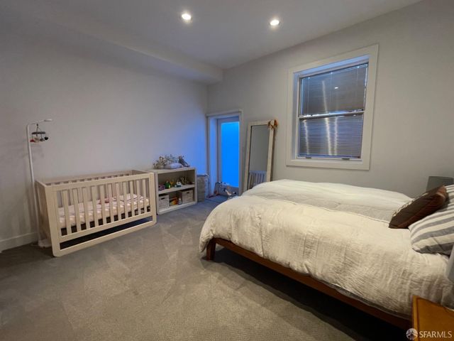 a view of a house with a flower garden