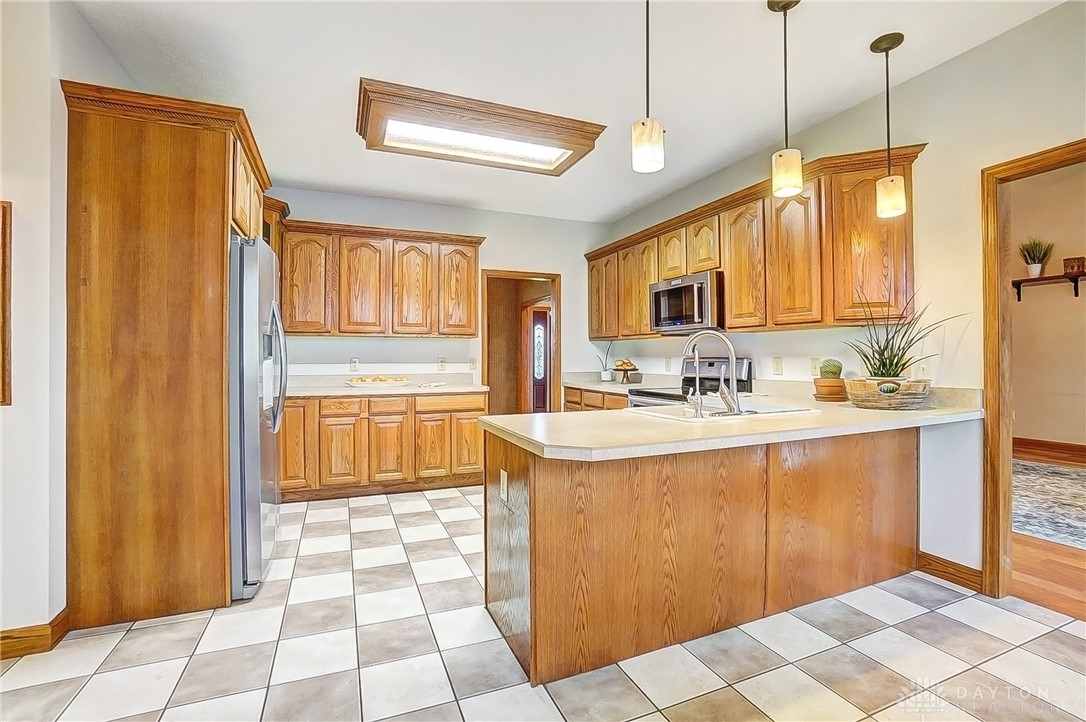 1540 Jasper Road Xenia, OH 45385 - Photo 17 of 91 This spacious kitchen offers ample cabinetry, modern appliances, and a convenient island.