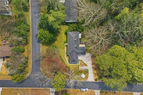 an aerial view of a house with outdoor space