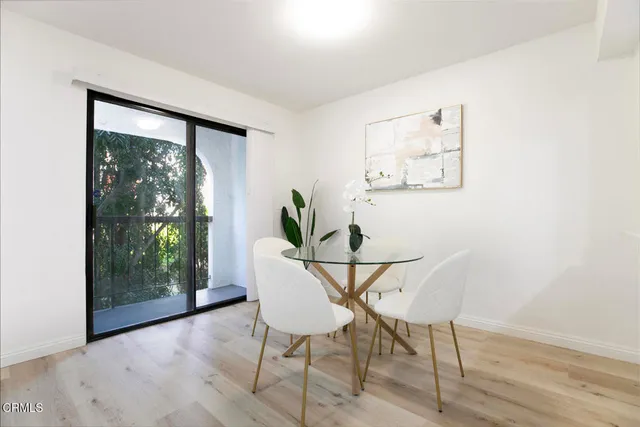 a view of a livingroom with furniture and wooden floor