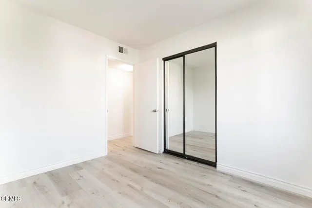 a view of a small space with wooden floor