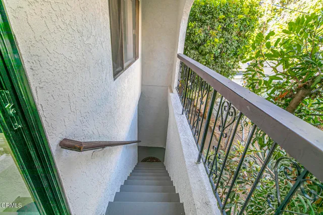 an entryway with a plant in front of it