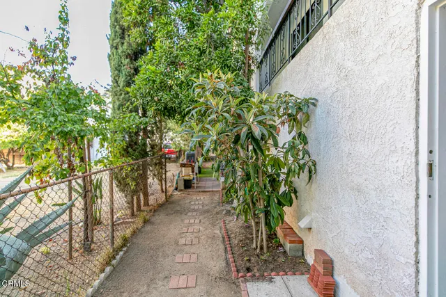 a view of a storage & utility room with two washing machine