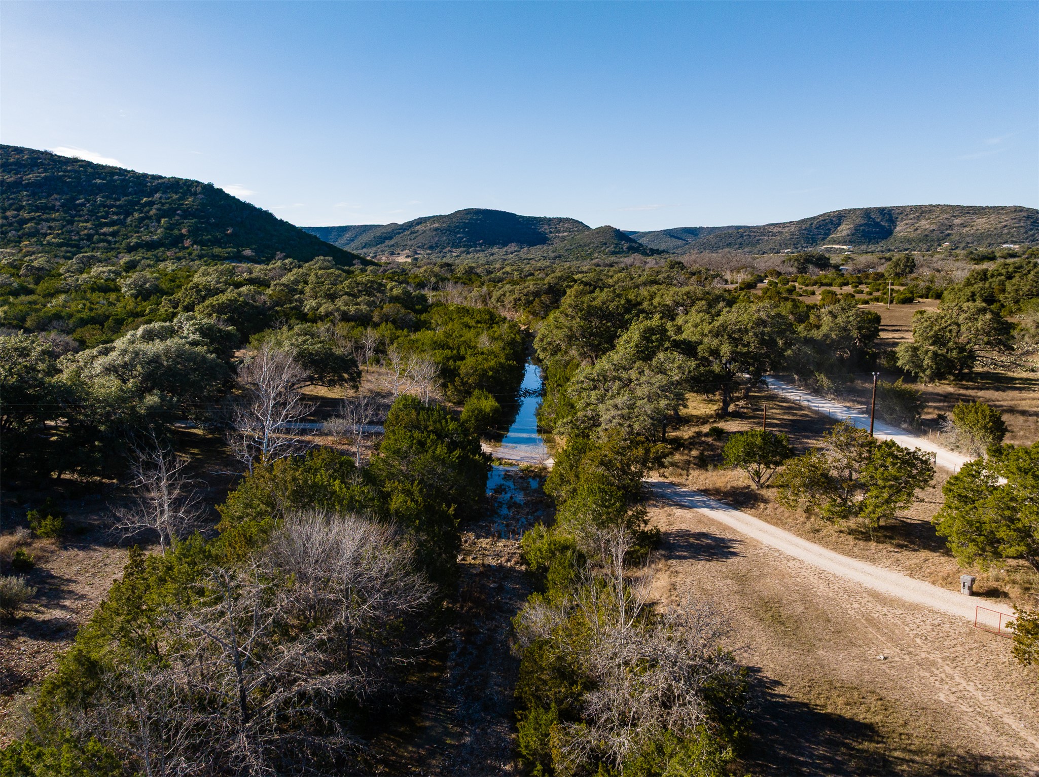 641 Patterson Creek Road Leakey, TX 78873 - Photo 11 of 31 Aerial view of a mountain backdrop