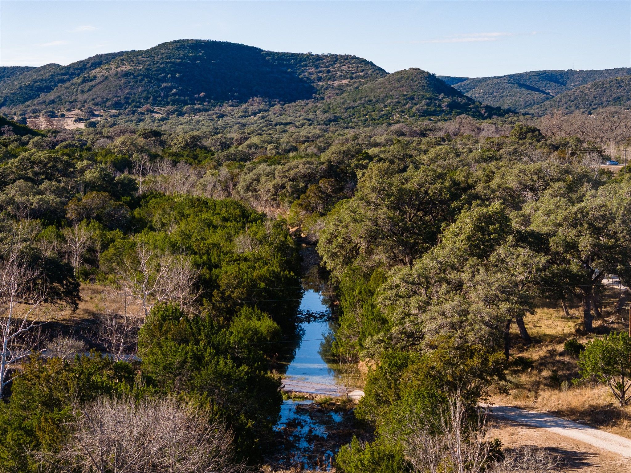 641 Patterson Creek Road Leakey, TX 78873 - Photo 12 of 31 View of mountain backdrop with a large body of water