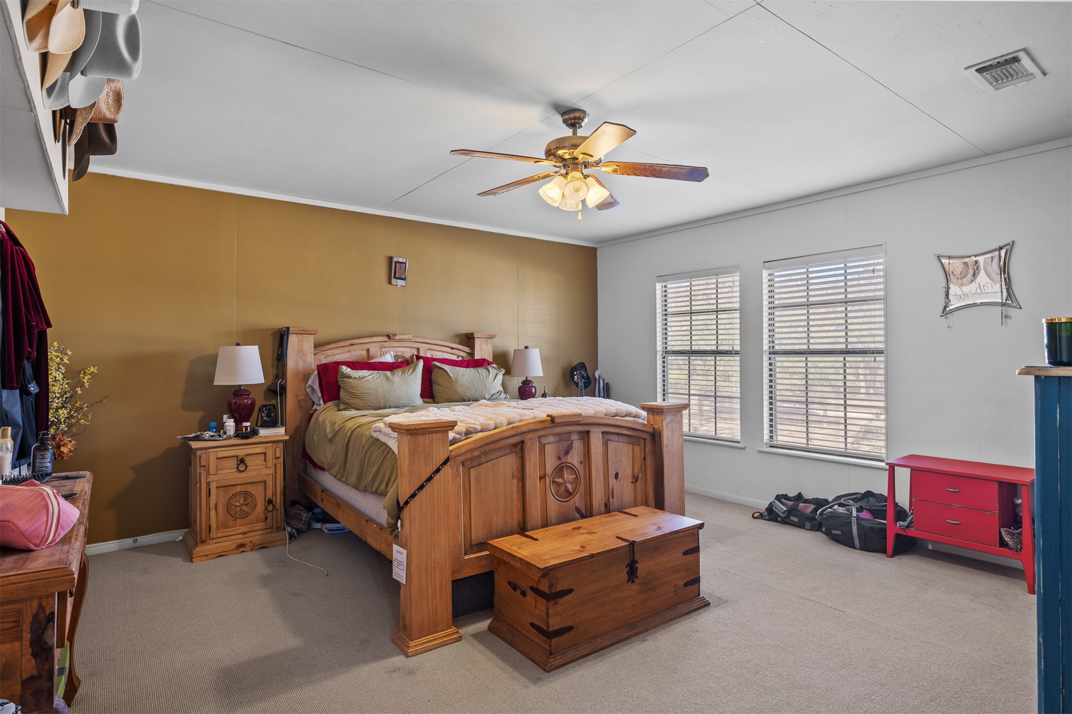 641 Patterson Creek Road Leakey, TX 78873 - Photo 18 of 31 Carpeted bedroom with ceiling fan and crown molding
