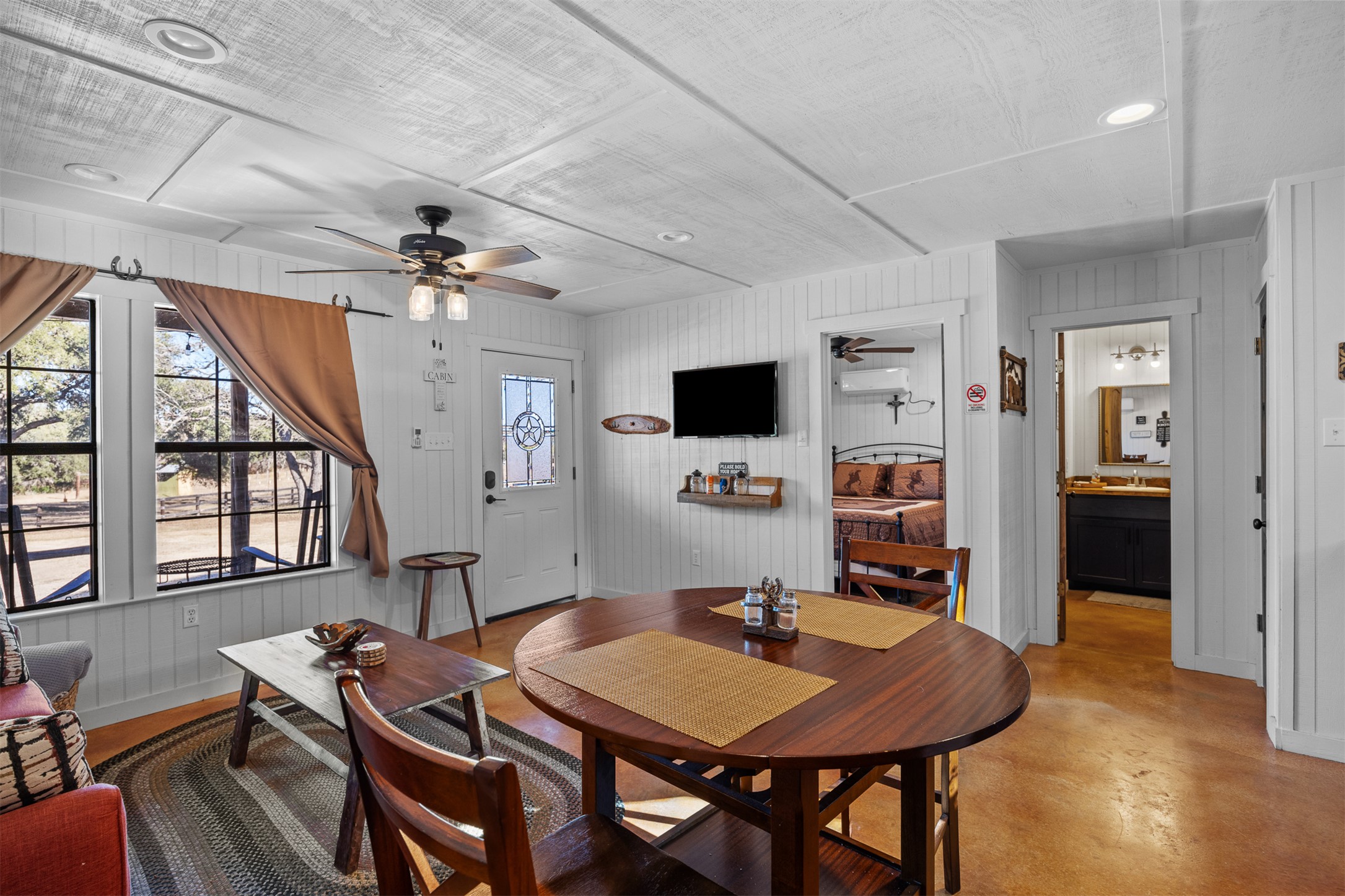 641 Patterson Creek Road Leakey, TX 78873 - Photo 27 of 31 Dining area with ceiling fan, concrete floors, and recessed lighting