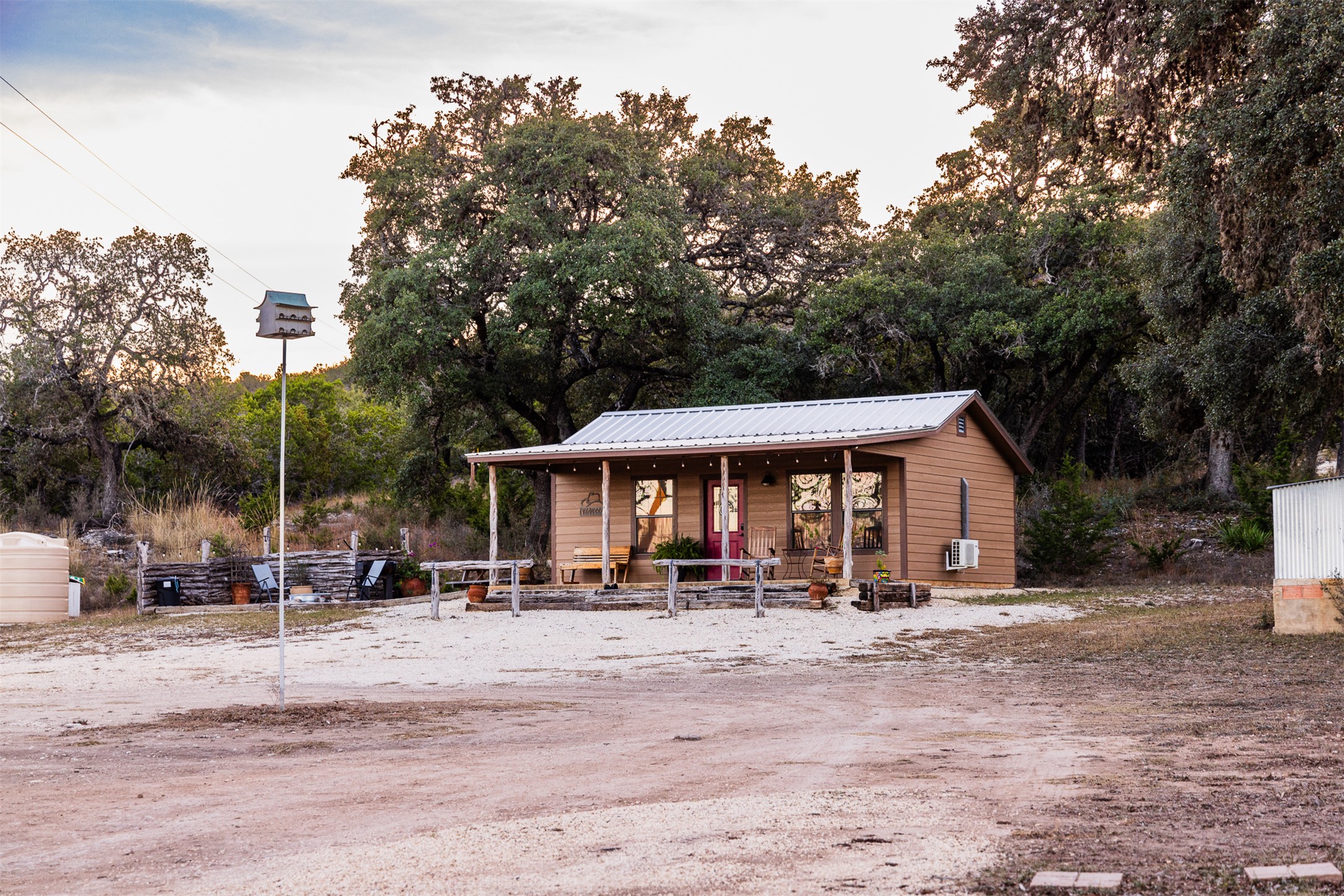 641 Patterson Creek Road Leakey, TX 78873 - Photo 7 of 31 View of home's community featuring a porch and view of wooded area