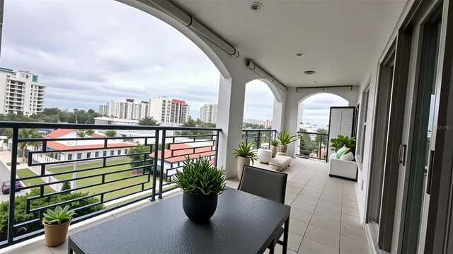 a living room filled with furniture and a potted plant